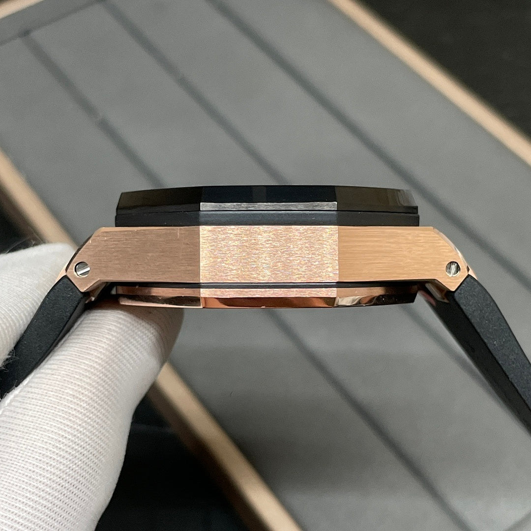Rose gold watch case with black strap and crown, shown in side profile