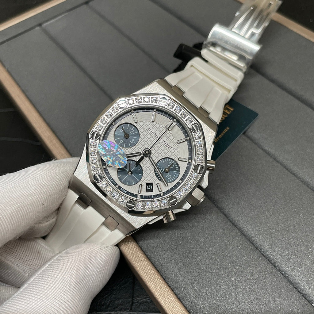 Diamond-trim luxury chronograph wristwatch with white dial, blue subdials, white strap