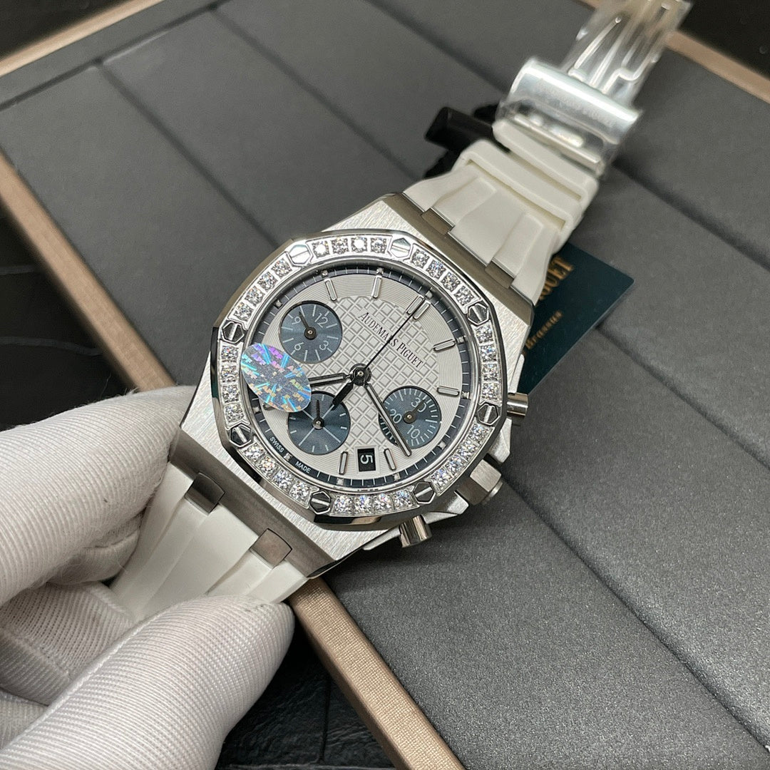 Diamond-trim luxury chronograph wristwatch with white dial, blue subdials, white strap