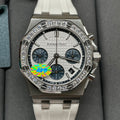 Diamond bezel luxury chronograph wristwatch with silver case and white dial, white strap