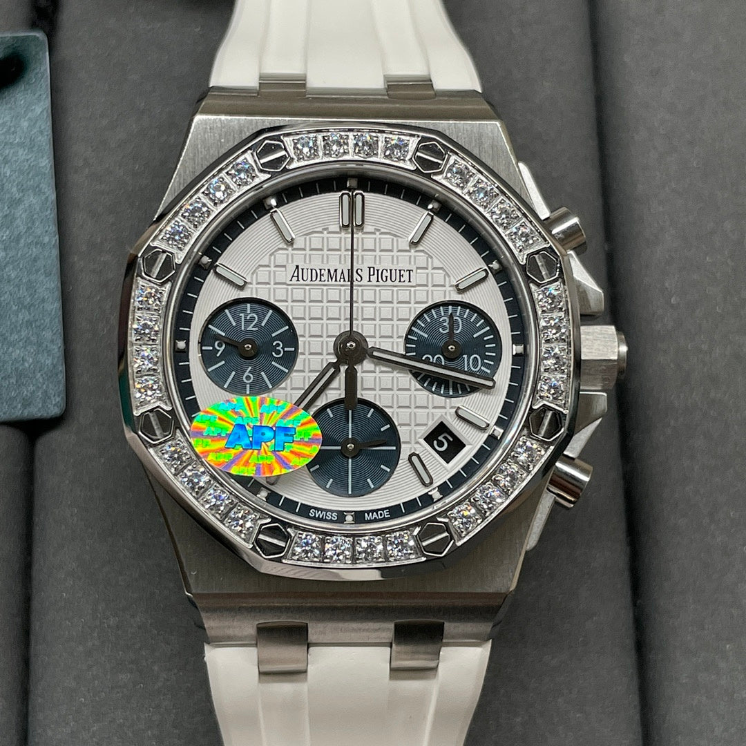 Diamond bezel luxury chronograph wristwatch with silver case and white dial, white strap