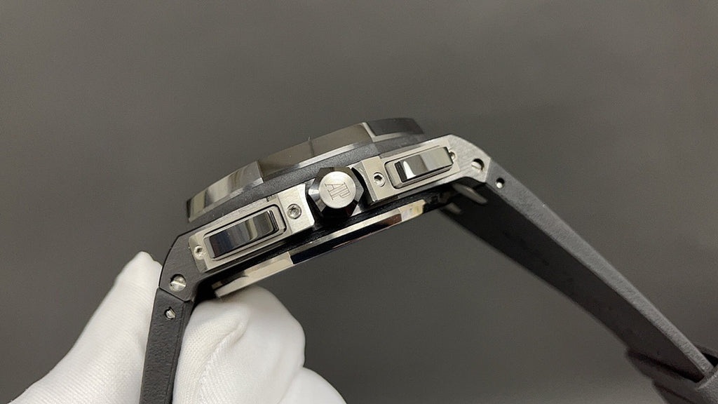 Audemars Piguet wristwatch top view with crown and buttons, black strap