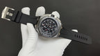 Audemars Piguet wristwatch angled view, black dial with red accents, rubber strap