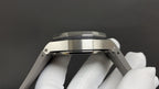 Stainless steel watch case profile with brushed bezel and crown guards