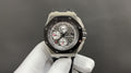 Steel chronograph watch with black dial, Audemars Piguet Royal Oak, on rubber strap