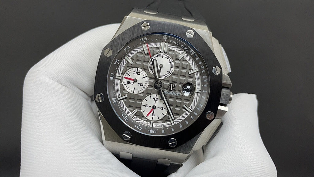 Audemars Piguet Royal Oak chronograph watch with black textured dial and rubber strap