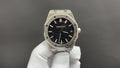 Audemars Piguet watch with black textured dial, steel octagonal case, and bracelet