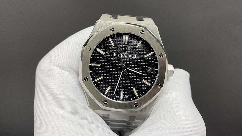 Audemars Piguet watch with black dial, baton hour markers, and steel octagonal case