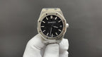 Audemars Piguet watch front view with black textured dial and steel octagonal case