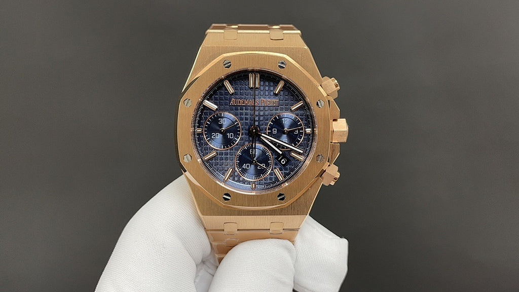Audemars Piguet watch with gold-tone case and blue chronograph dial on bracelet