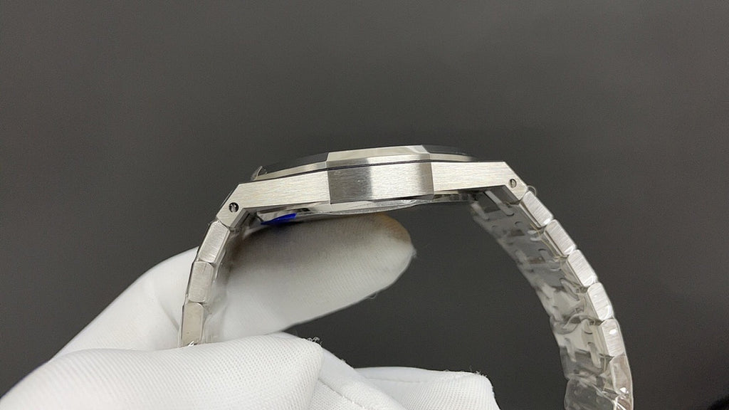 Audemars Piguet watch side view with silver case and textured bracelet links
