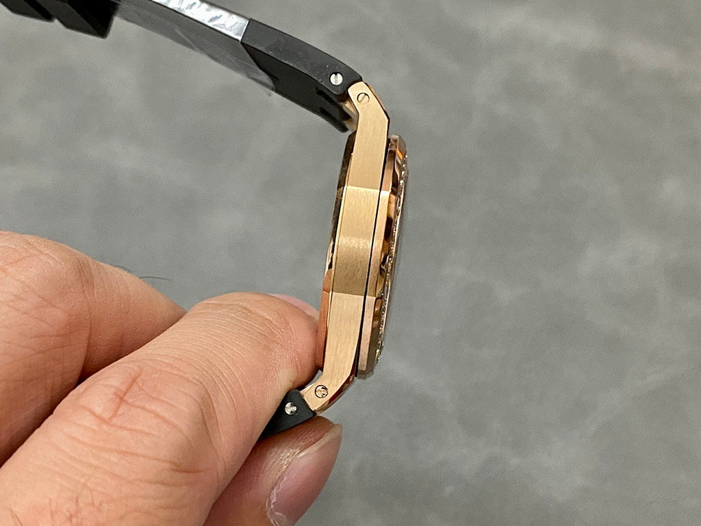Rose gold Royal Oak watch with black strap, visible case thickness and screws
