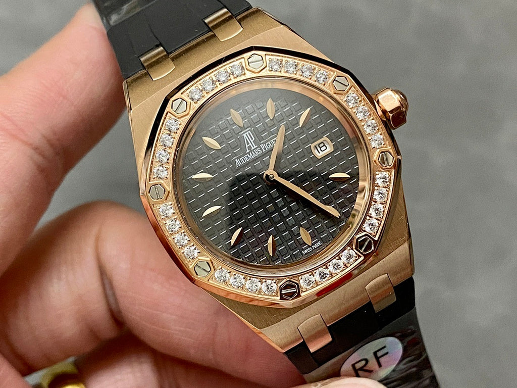 Rose gold Royal Oak watch with diamond bezel, dark dial with raised markers and date
