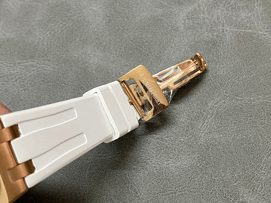 White rubber watch strap with rose gold-tone buckle clasp and engraved brand mark.