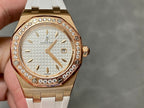 Rose gold-tone watch with white textured dial, diamond bezel, and white rubber strap.