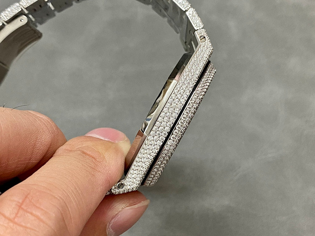 Diamond-studded watch bracelet links with clasp edge viewed from the side