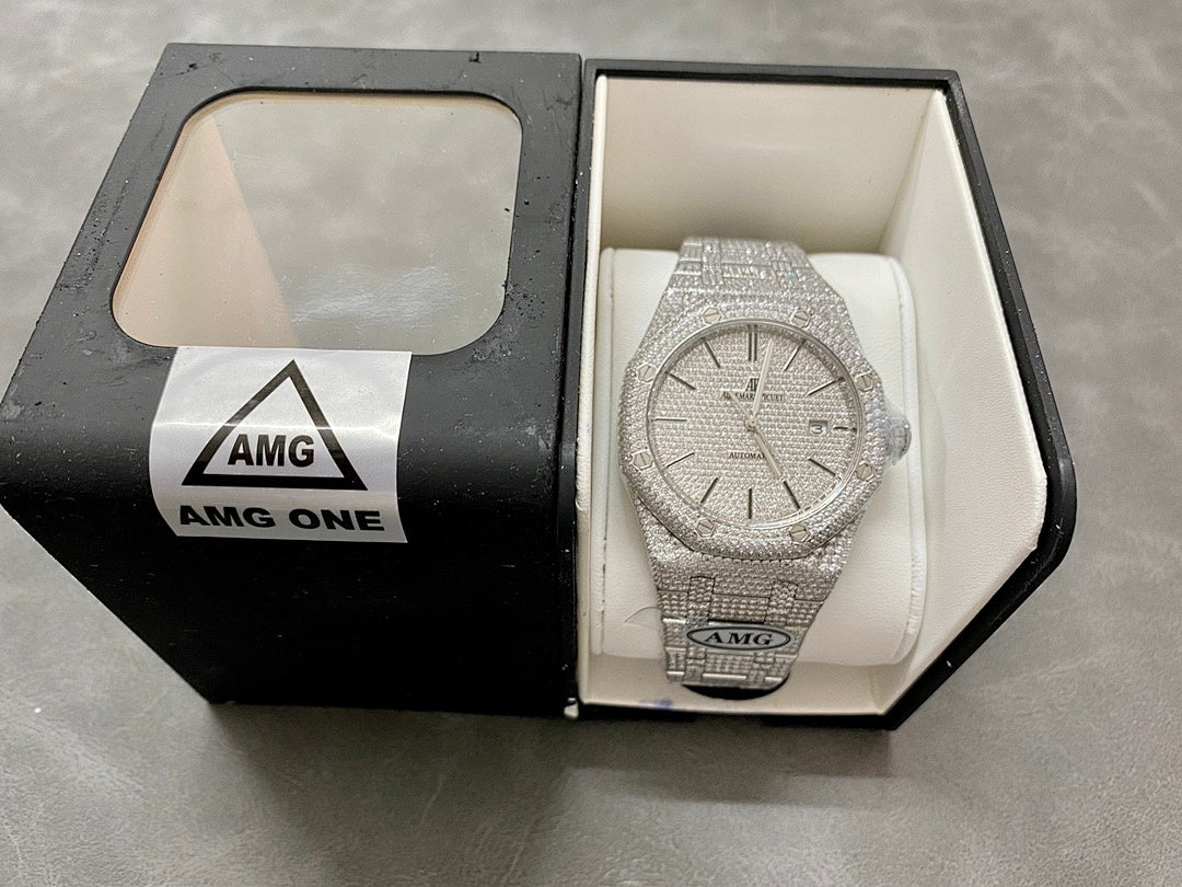 Silver-toned diamond-studded watch displayed in open box on white cushion