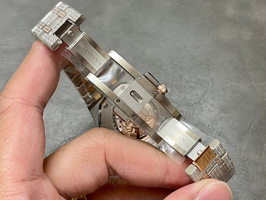 Wristwatch clasp and bracelet underside view with diamond-studded links