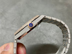 Wristwatch bracelet side view with diamond links and a blue accent detail