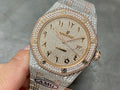 Diamond-encrusted wristwatch with champagne dial, AP logo, and date window