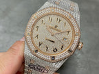 Diamond-encrusted wristwatch with champagne dial, AP logo, and date window