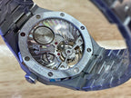 Audemars Piguet watch caseback with visible gears and balance wheel