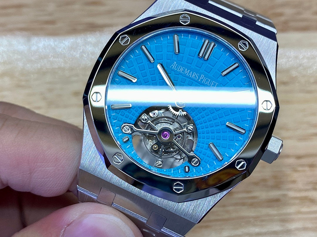 Audemars Piguet watch with blue dial and exposed automatic-style movement