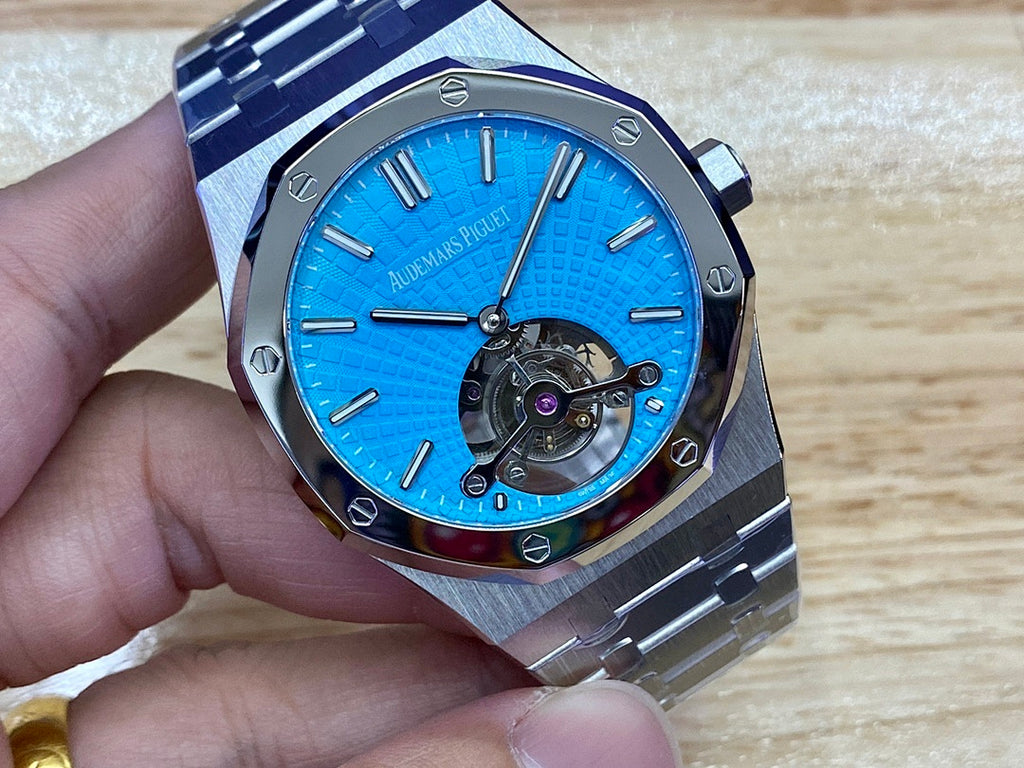 Audemars Piguet watch with blue textured dial, stainless case, and bracelet