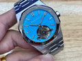 Audemars Piguet watch with blue textured dial, stainless case, and bracelet