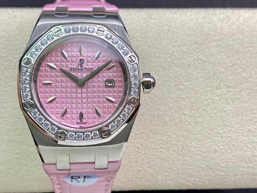 Pink dial diamond bezel wristwatch on pink strap with round steel case