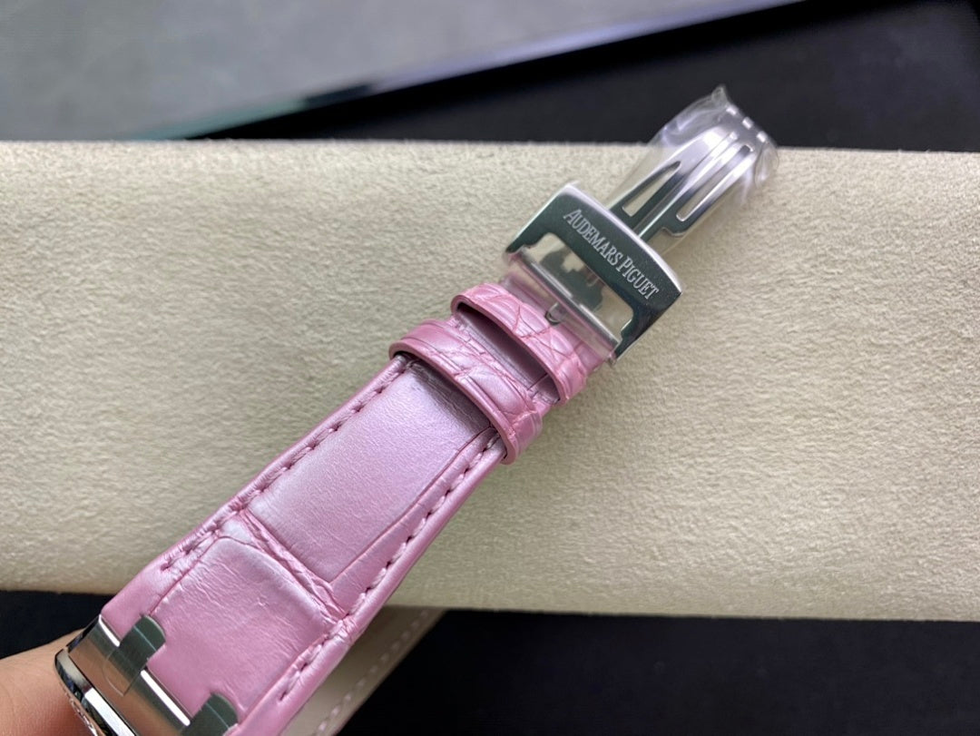Pink leather watch strap with clasp hardware and stamped branding
