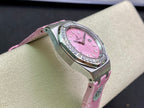 Round steel wristwatch with pink dial, diamond bezel, and pink leather strap