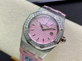 Pink dial diamond bezel wristwatch with pink strap, steel case and crown