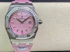 Pink dial diamond bezel wristwatch with pink strap and steel crown detail