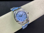 Audemars Piguet wristwatch with blue dial and diamond bezel on light blue leather strap