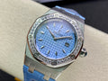 Audemars Piguet wristwatch with blue dial, diamond bezel, blue leather strap