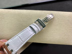 White leather watch strap with metal buckle and stitched edges