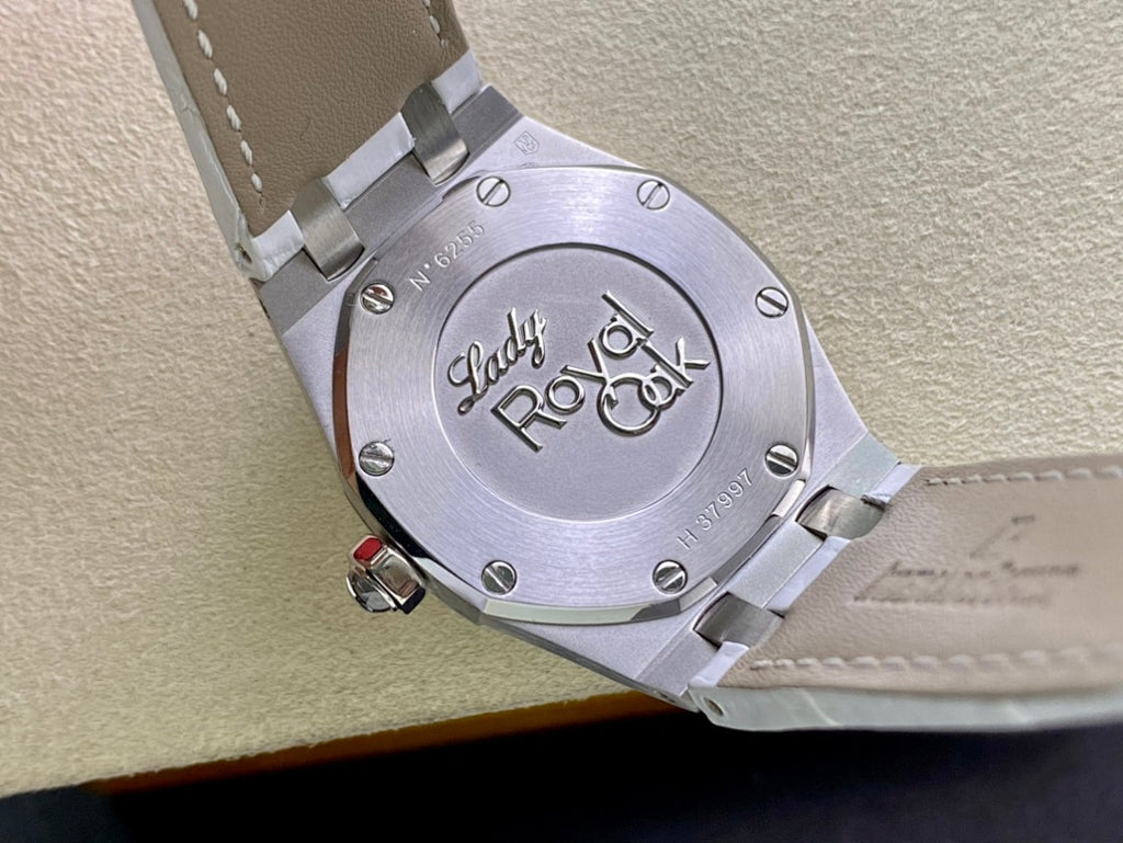 Audemars Piguet watch caseback with engraved logo and metal bracelet link