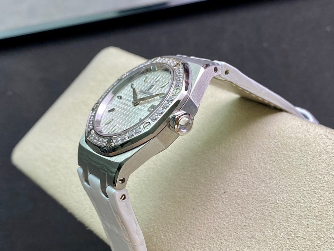 Audemars Piguet wristwatch side profile with silver case, diamond bezel, white dial