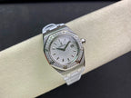 Audemars Piguet wristwatch angled view with silver case, diamond bezel, white dial, strap