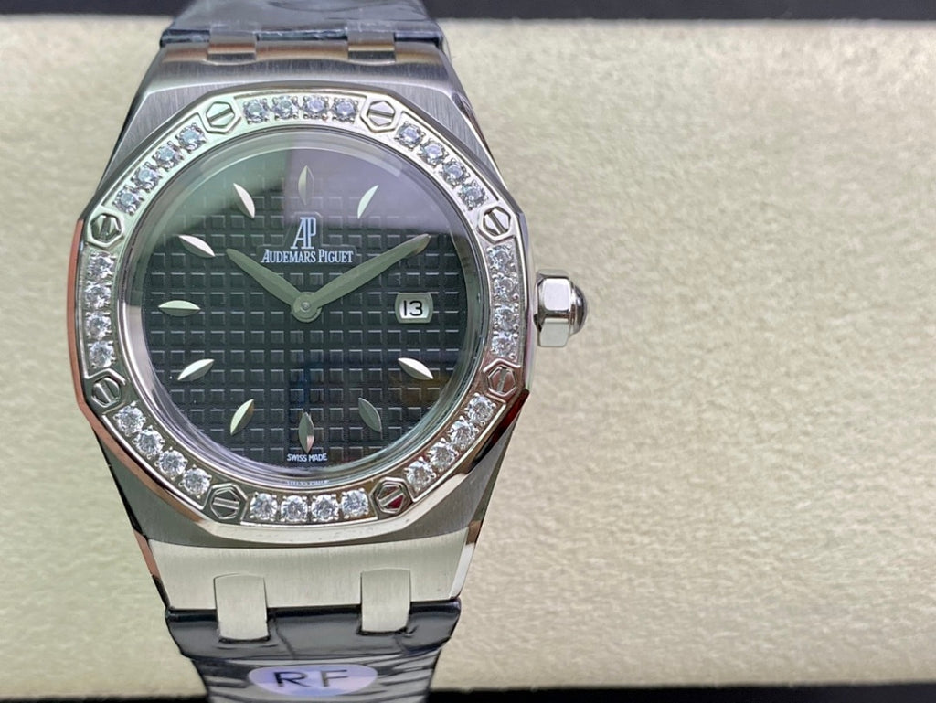 Audemars Piguet watch on display with silver case, dark dial, diamond bezel, blue strap