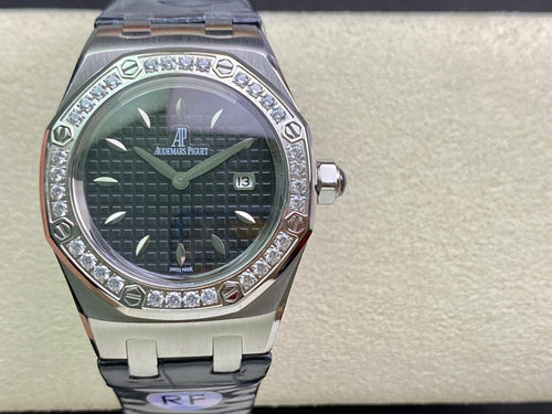 Audemars Piguet watch on display with silver case, dark dial, diamond bezel, blue strap