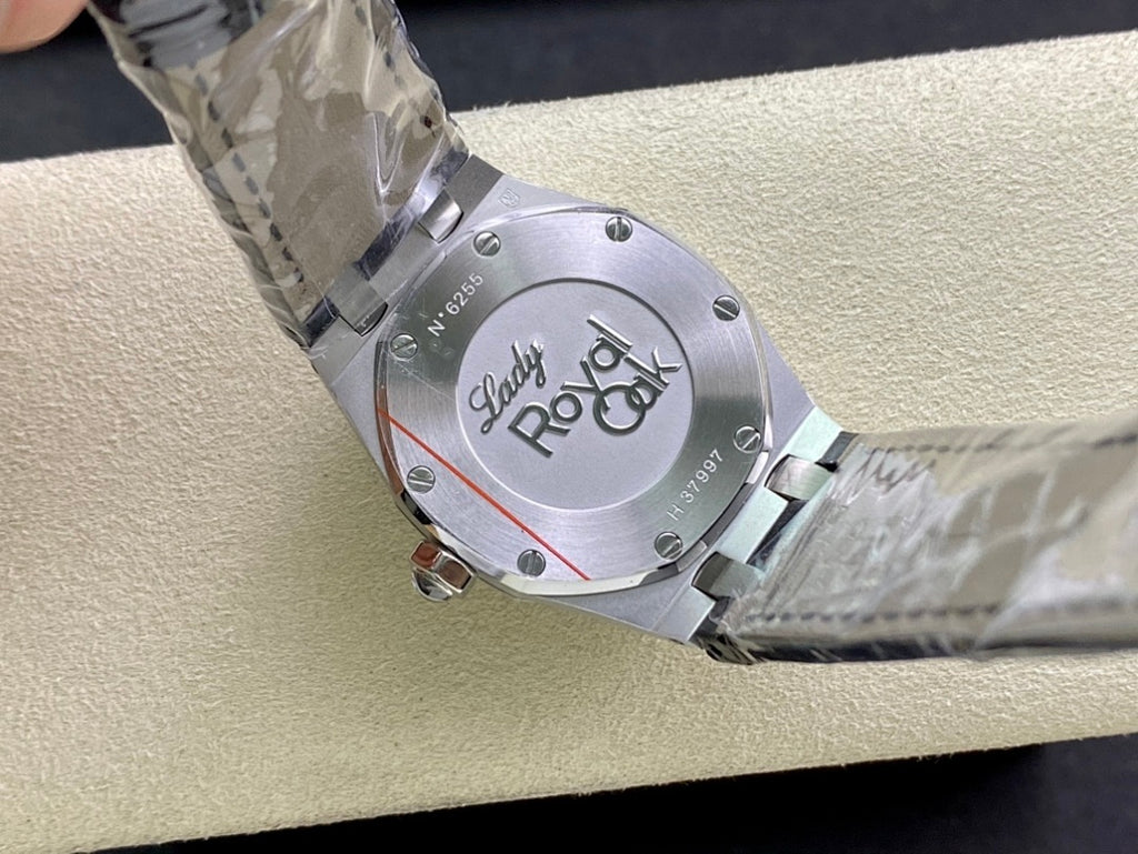 Audemars Piguet watch case back with engraved markings and blue strap