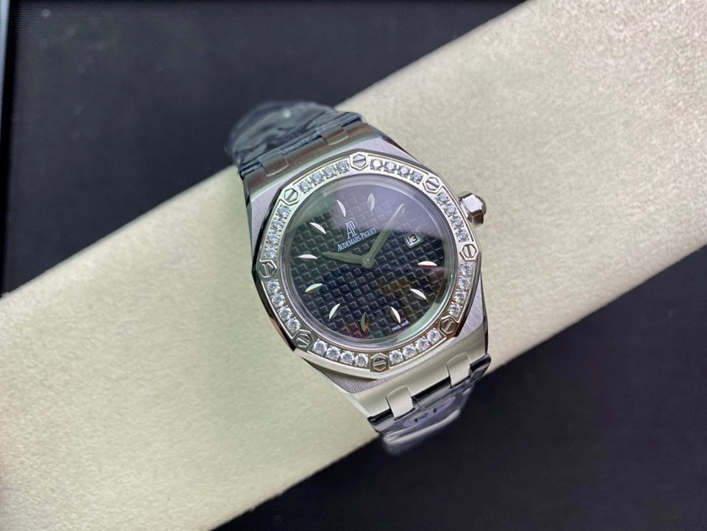Audemars Piguet watch with round silver case, dark green dial, diamond bezel, blue strap