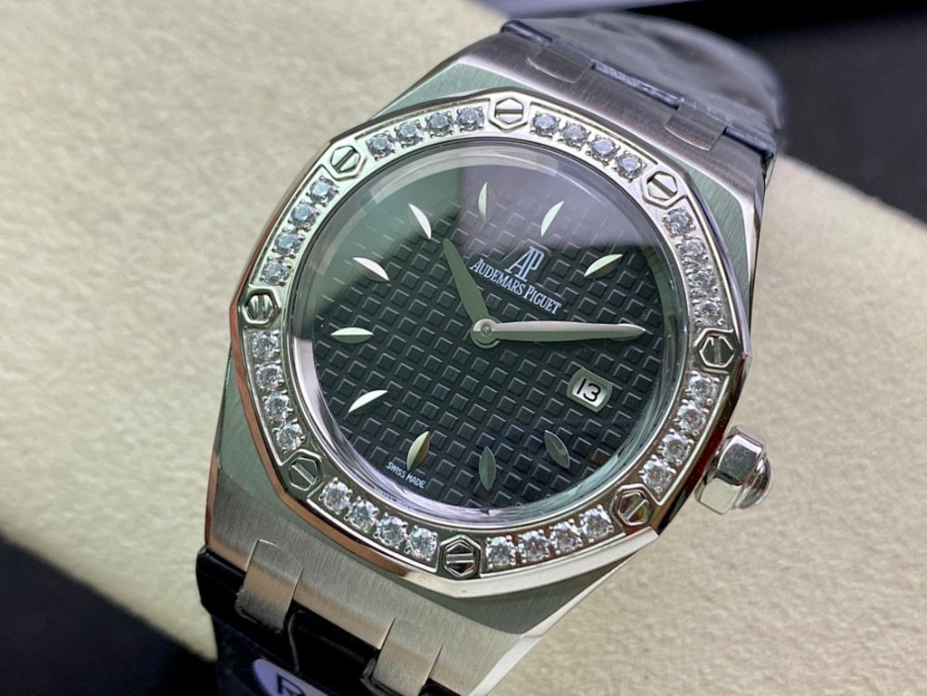 Audemars Piguet watch with silver case, dark green textured dial, diamond bezel, blue strap