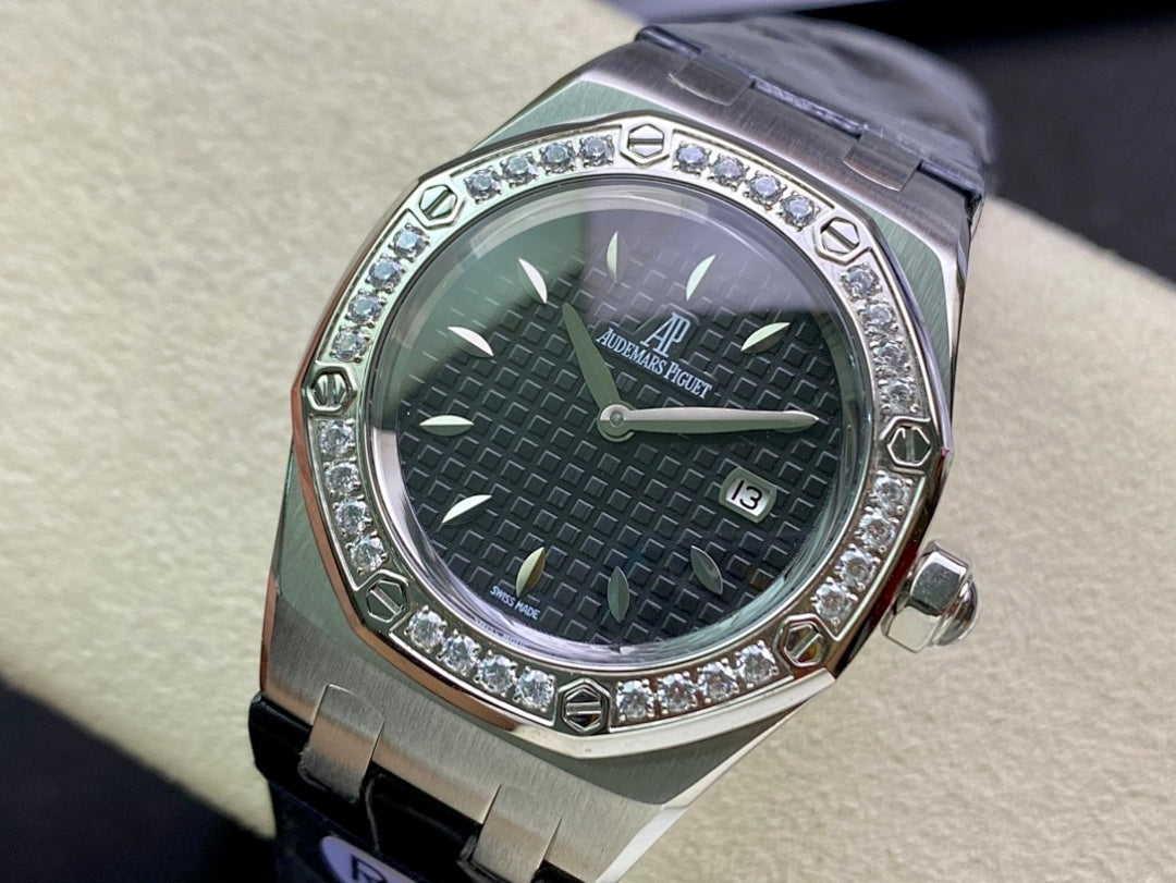 Audemars Piguet watch with silver case, dark green textured dial, diamond bezel, blue strap