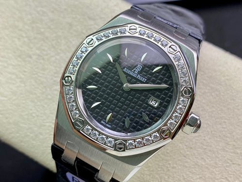 Audemars Piguet watch with silver case, dark green textured dial, diamond bezel, blue strap
