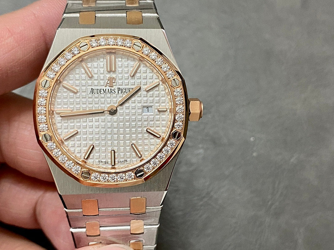 Audemars Piguet watch front view with white textured dial, gold hands, and diamond bezel