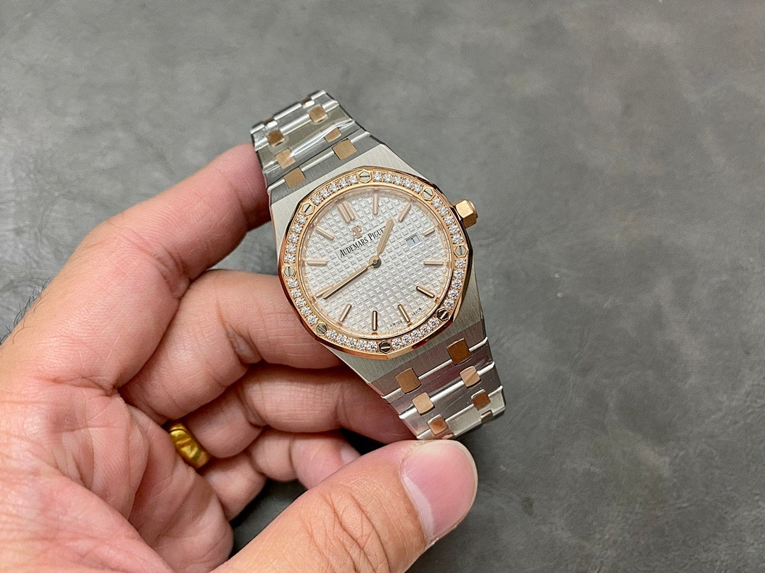 Audemars Piguet watch on hand, white dial with diamond bezel and steel-gold bracelet