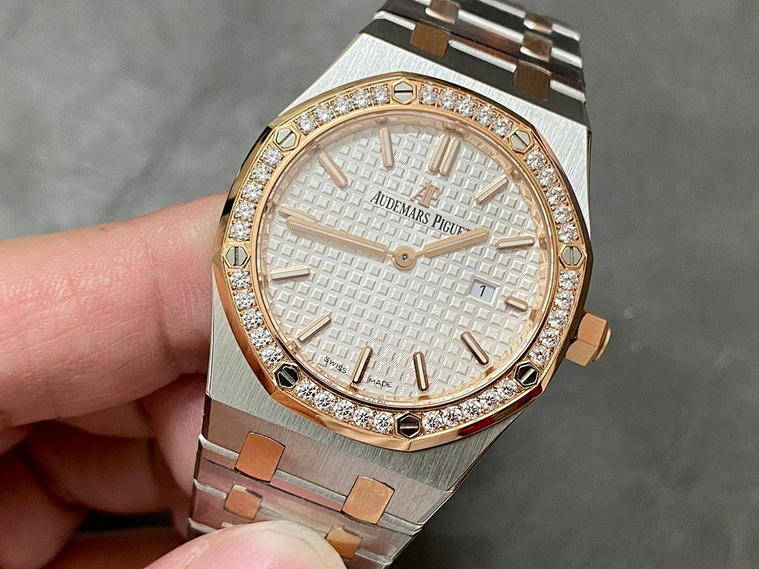 Audemars Piguet watch with diamond bezel, white dial, and steel-and-gold link bracelet